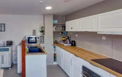Cuisine ou kitchenette dans l'établissement Maison En Campagne Normandie
