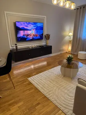 Télévision ou salle de divertissement dans l'établissement Cosy and Chic Appartement moderne proche gare