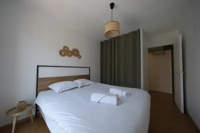 Un ou plusieurs lits dans un hébergement de l'établissement Lumineux T3 - 2 chambres, balcon - proche de Rouen