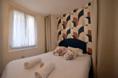 Un ou plusieurs lits dans un hébergement de l'établissement Rouen - Studio indépendant avec cour