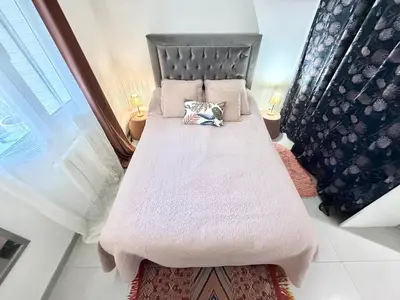 Un ou plusieurs lits dans un hébergement de l'établissement Maison La Palmeraie - Jardin au calme, gare à 5 min