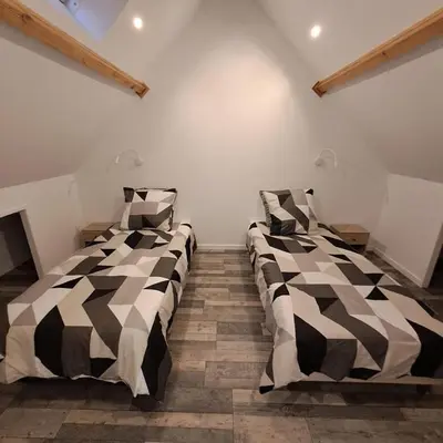 Un ou plusieurs lits dans un hébergement de l'établissement Maisonnette 49m2 à 5 minutes de chantilly