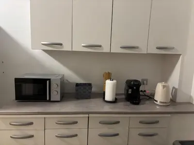 Cuisine ou kitchenette dans l'établissement Marcory, proche aéroport