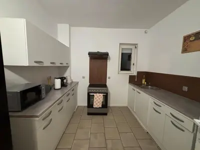 Cuisine ou kitchenette dans l'établissement Marcory, proche aéroport