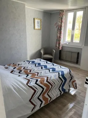Un ou plusieurs lits dans un hébergement de l'établissement Villa la surprise