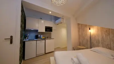 Un ou plusieurs lits dans un hébergement de l'établissement Studio pratique et cosy Rouen centre