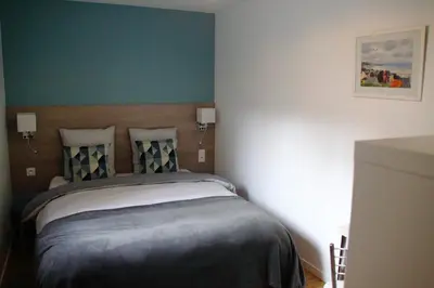 Un ou plusieurs lits dans un hébergement de l'établissement Villa Quai 22 Vue Port !