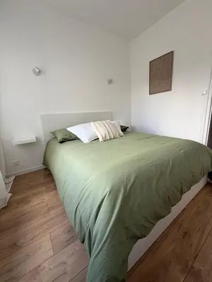 Un ou plusieurs lits dans un hébergement de l'établissement Appartement neuf, moderne et lumineux à Vernon