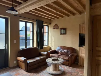 Coin salon dans l'établissement Le Gîte du Bonheur - Maison normande familiale
