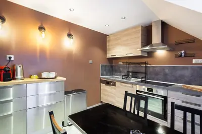 Cuisine ou kitchenette dans l'établissement Suite Appart Place Versepuy
