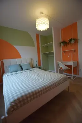 Un ou plusieurs lits dans un hébergement de l'établissement La Rétro-Capsule - 2 chambres & parking
