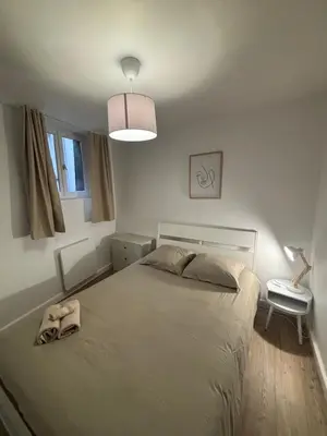 Un ou plusieurs lits dans un hébergement de l'établissement charmant appartement 4 pers hyper centre, au calme