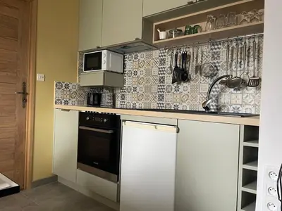 Cuisine ou kitchenette dans l'établissement L'Ormelet