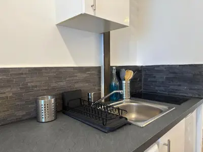 Cuisine ou kitchenette dans l'établissement Appartement tout confort d Elbeuf -proche gare