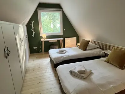 Un ou plusieurs lits dans un hébergement de l'établissement La Petite Ferme d Hyberville