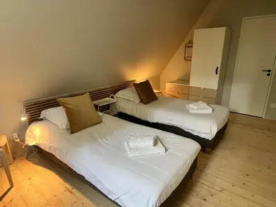 Un ou plusieurs lits dans un hébergement de l'établissement La Petite Ferme d Hyberville