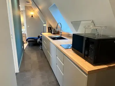 Cuisine ou kitchenette dans l'établissement La Petite Ferme d Hyberville