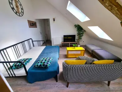 Coin salon dans l'établissement L'appartement tranquillité