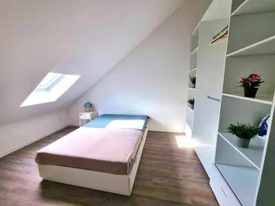 Un ou plusieurs lits dans un hébergement de l'établissement L'appartement tranquillité