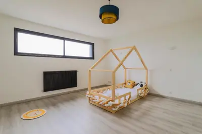 Un ou plusieurs lits dans un hébergement de l'établissement La Maison Bellevue - Garden Parking 13 min from Amiens