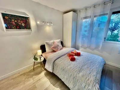 Un ou plusieurs lits dans un hébergement de l'établissement Neuf et lumineux 2min Gare - 20min Paris