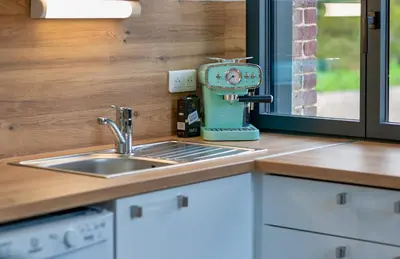 Cuisine ou kitchenette dans l'établissement Le Hameau Paisible