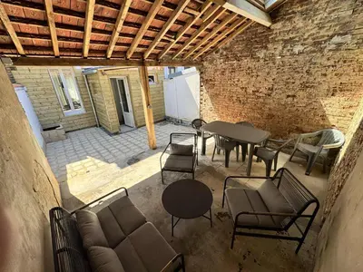 Coin salon dans l'établissement Maison Entre Verre et Mer