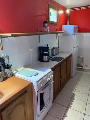 Cuisine ou kitchenette dans l'établissement A l'orée des bois
