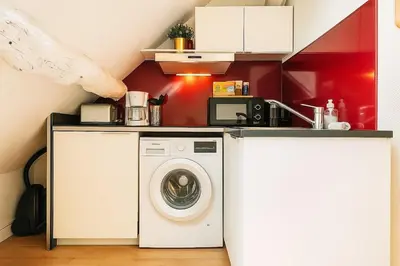 Cuisine ou kitchenette dans l'établissement Le Nid Rouennais - 414