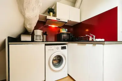 Cuisine ou kitchenette dans l'établissement Le Nid Rouennais - 414
