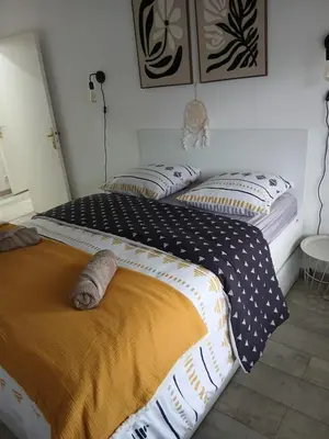 Un ou plusieurs lits dans un hébergement de l'établissement Cosy Jolie T3 - Centre & Parking gratuit