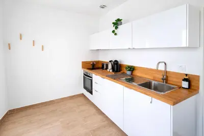 Cuisine ou kitchenette dans l'établissement Gare Oissel - Le Paon