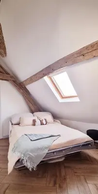 Un ou plusieurs lits dans un hébergement de l'établissement Charmant appartement 2 pièces, 1 chambres