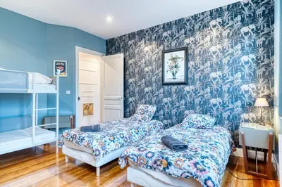 Un ou plusieurs lits dans un hébergement de l'établissement Magnifique Duplex plein centre ville - 15 pers - 200m2 - 600m plage !