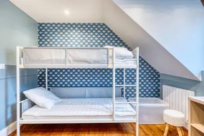 Un ou plusieurs lits dans un hébergement de l'établissement Magnifique Duplex plein centre ville - 15 pers - 200m2 - 600m plage !