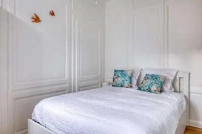 Un ou plusieurs lits dans un hébergement de l'établissement Blue Bird charmant studio avec place de parking !
