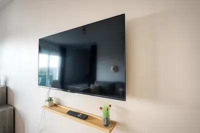 Télévision ou salle de divertissement dans l'établissement L Escapade Marine