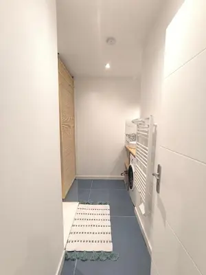 Cuisine ou kitchenette dans l'établissement L'Océan - Ambiance Apaisante & Rafraichissante