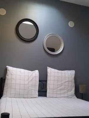 Un ou plusieurs lits dans un hébergement de l'établissement Magnifique Studios proche de Paris dans le Yvelines