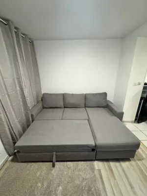 Coin salon dans l'établissement Appartement à 10 minutes du centre-ville