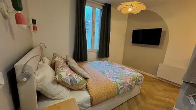 Un ou plusieurs lits dans un hébergement de l'établissement Le Cocon du Jardin duplex cosy, moderne et fibre