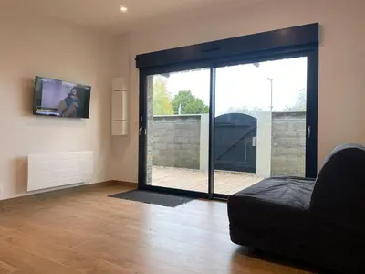 Télévision ou salle de divertissement dans l'établissement Les Cottages du Manoir