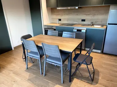Cuisine ou kitchenette dans l'établissement Les Cottages du Manoir