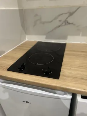 Cuisine ou kitchenette dans l'établissement Charmant Studio Mantes-La-Jolie