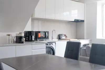 Cuisine ou kitchenette dans l'établissement Le Van G-Home