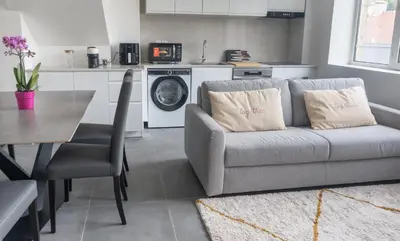 Coin salon dans l'établissement Le Van G-Home