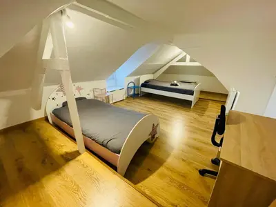 Un ou plusieurs lits dans un hébergement de l'établissement Havre de paix à Rouen duplex lumineux avec vue - 415