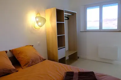Un ou plusieurs lits dans un hébergement de l'établissement Les vagues - Sea view house