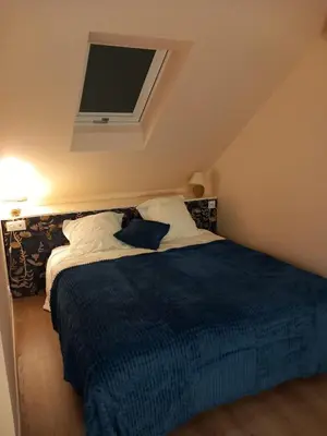 Un ou plusieurs lits dans un hébergement de l'établissement Chambre Cosy Eaubonne
