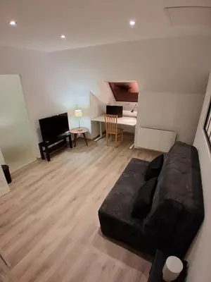 Coin salon dans l'établissement Studio meublé à la campagne